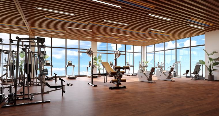 Gym with treadmills and weights facing full-height windows